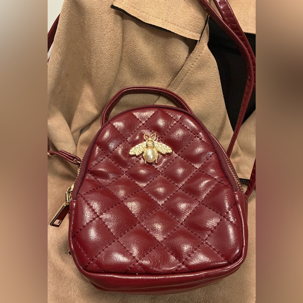 Burgundy Quilted Crossbody Bag with Gold Emblem